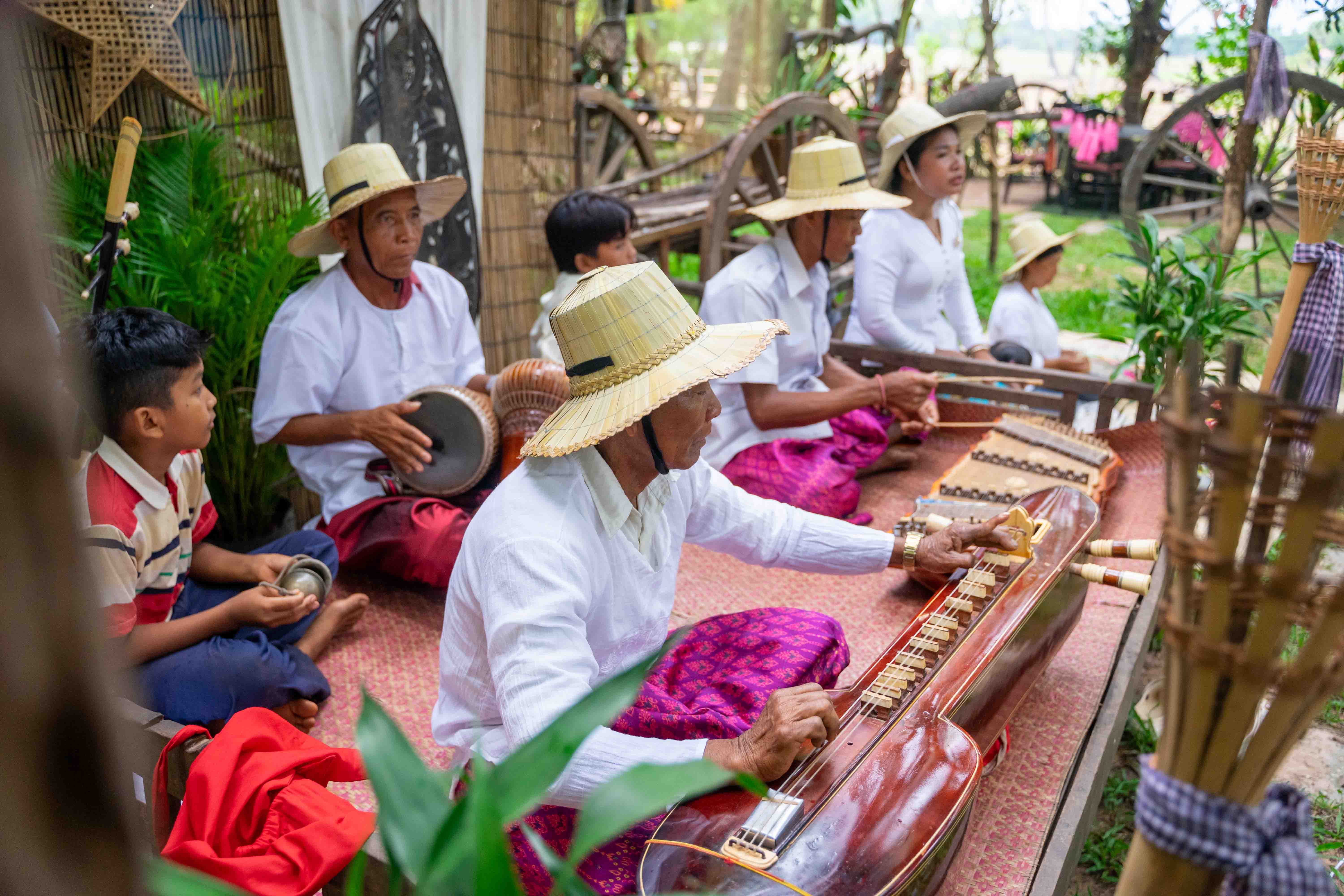 Traditional Khmer musicians performing outdoors in Preah Dak community, Siem Reap countryside
